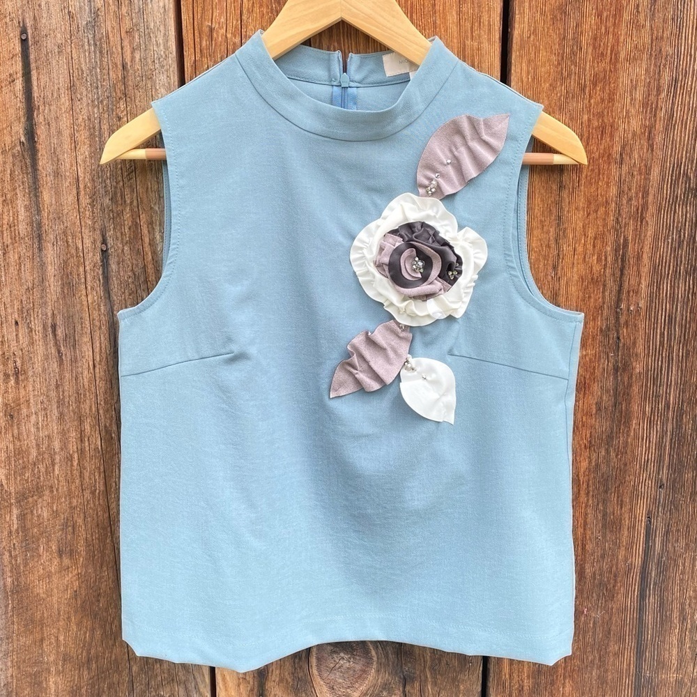 Anthropologie Mignon Doo Light Blue Top with Flower Embellishment Size M. NWT